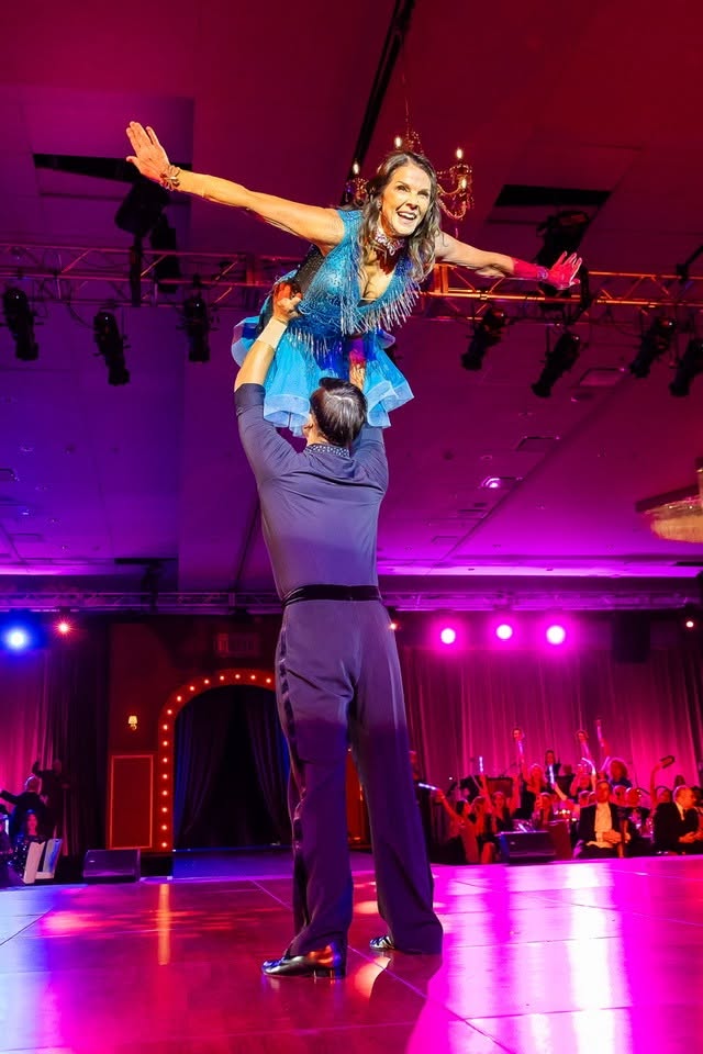 Nolan lifting his dance partner overhead at Dancing with the Stars Austin