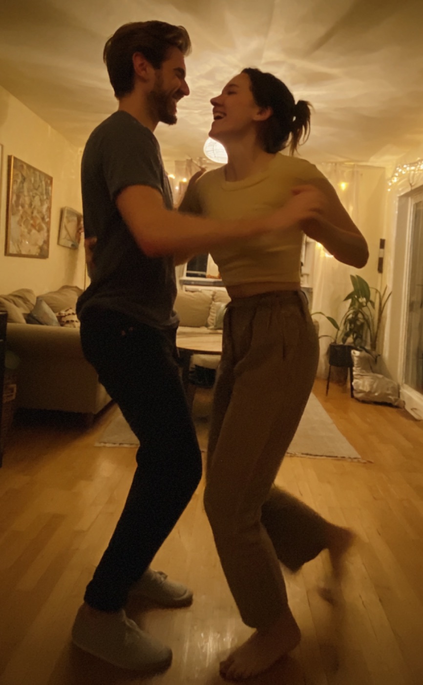 Couple taking a dance lesson at home