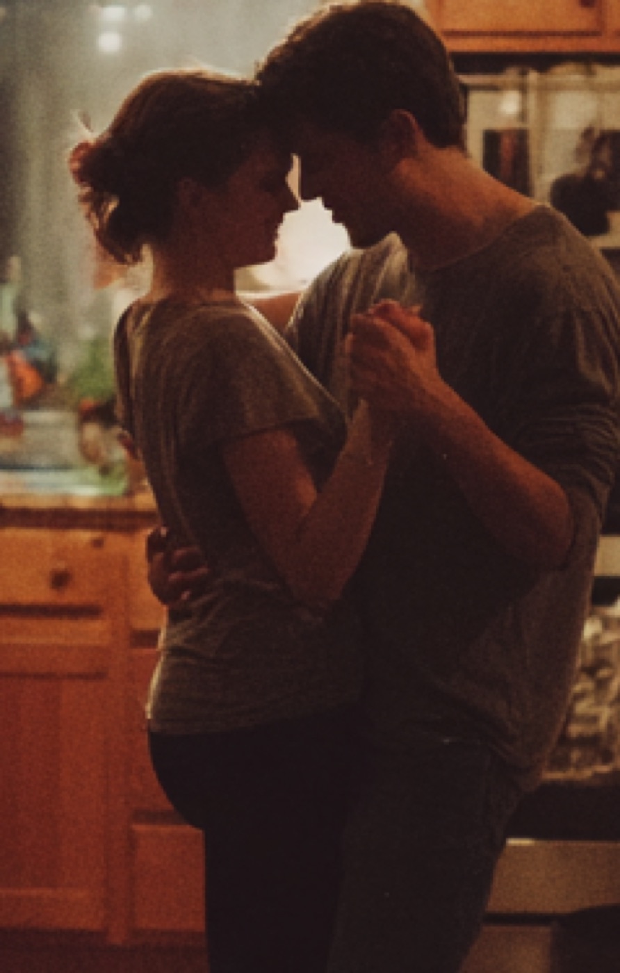 Couple slow dancing at home